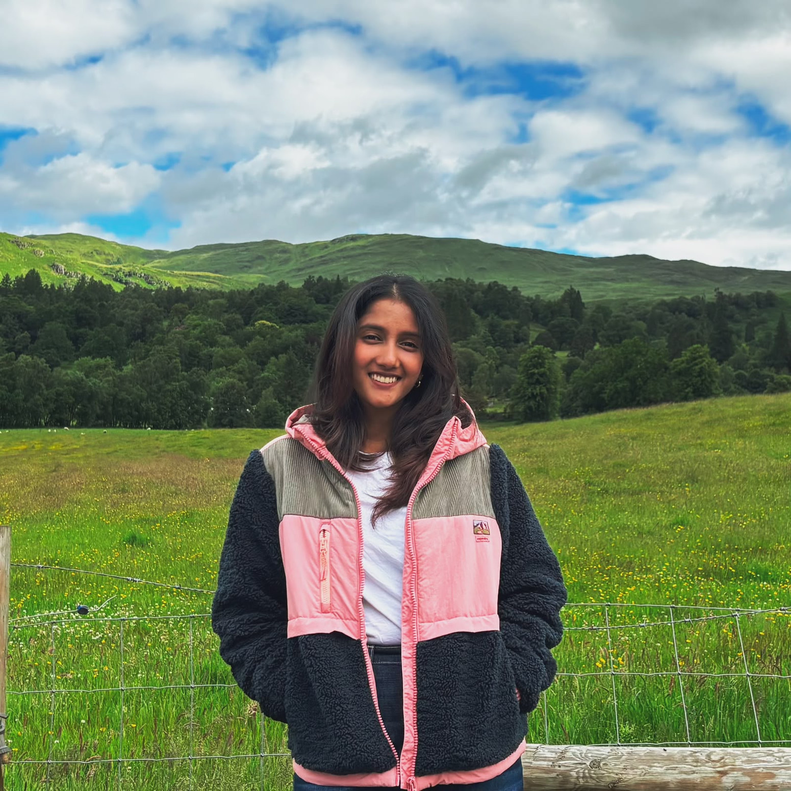 Priya in a green meadow